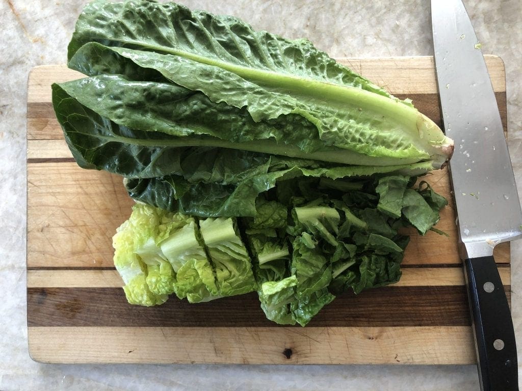 Head of Lettuce on Cutting Board